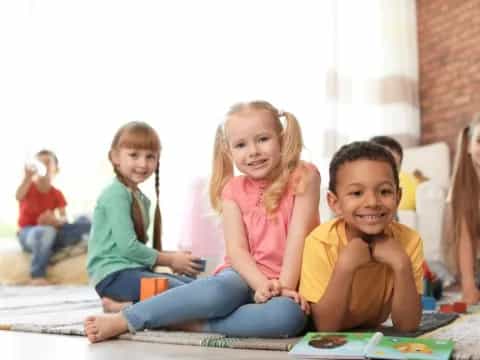 a group of children sitting on the floor