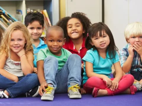 a group of children sitting on the floor