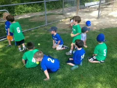 a group of kids playing with a ball