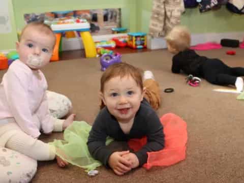 a group of children sitting on the floor