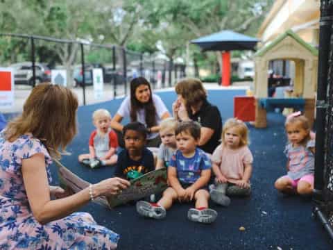 a group of people sitting on the ground