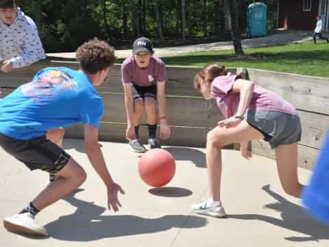 a group of people playing basketball