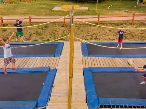 a group of people playing volleyball